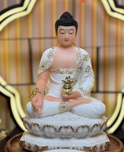 Tượng Phật Dược Sư bằng bột đá trắng cầm cây thuốc vàng