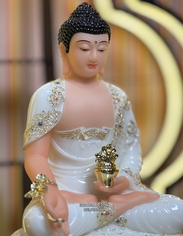 Tượng Phật Dược Sư bằng bột đá trắng cầm cây thuốc vàng