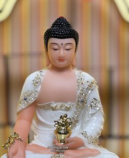 Tượng Phật Dược Sư bằng bột đá trắng cầm cây thuốc vàng