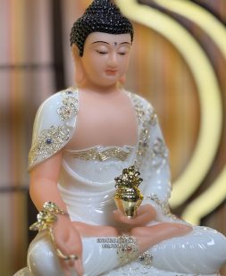 Tượng Phật Dược Sư bằng bột đá trắng cầm cây thuốc vàng
