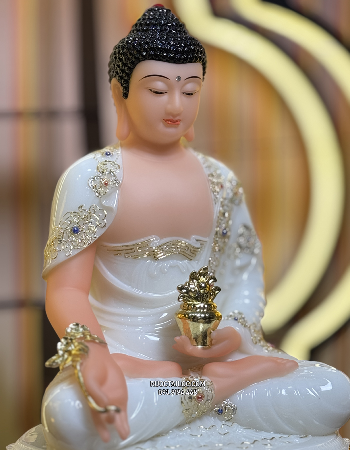 Tượng Phật Dược Sư bằng bột đá trắng cầm cây thuốc vàng