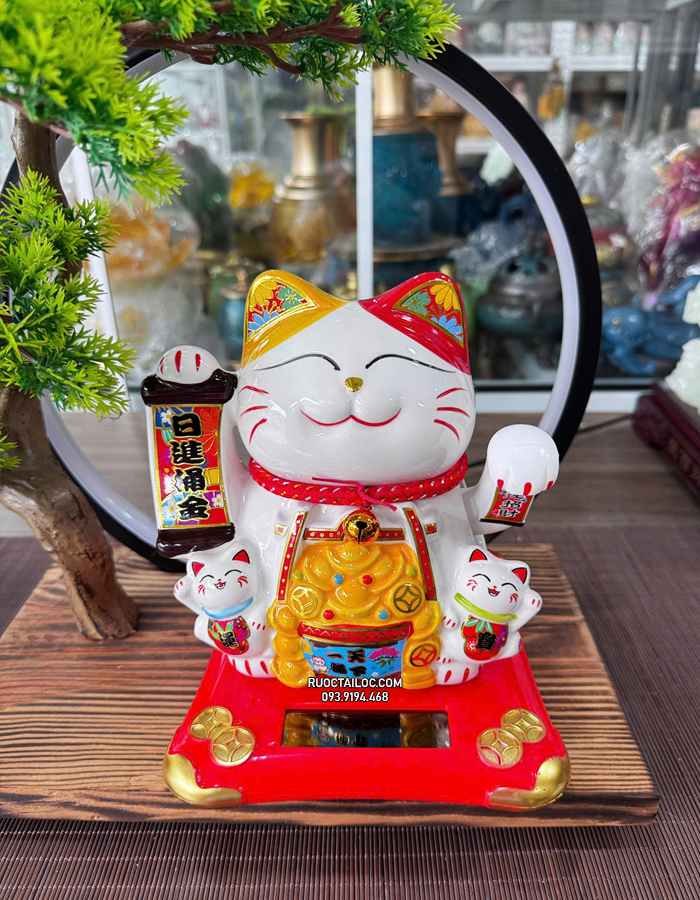 mèo thần tài năng lượng cầm liễn phát tài